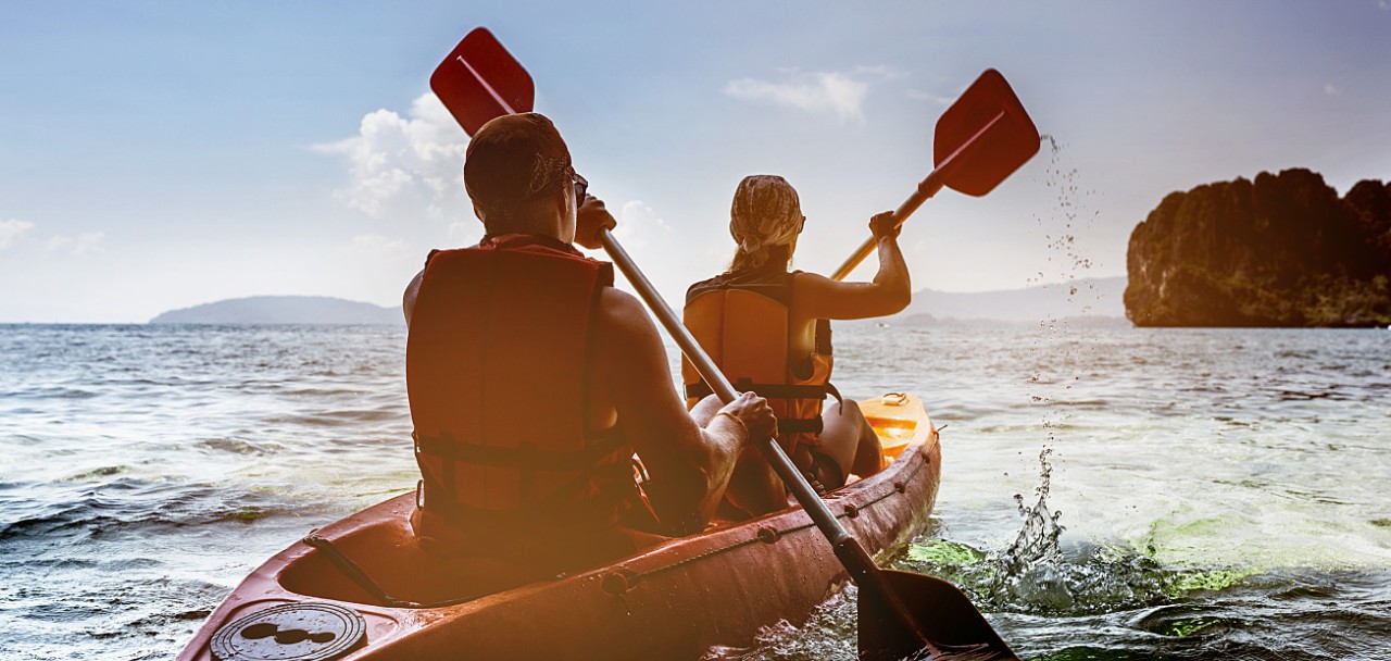 Man and woman swims on kayak in the sea on background of island. Kayaking concept; Shutterstock ID 603193598; PO: 123