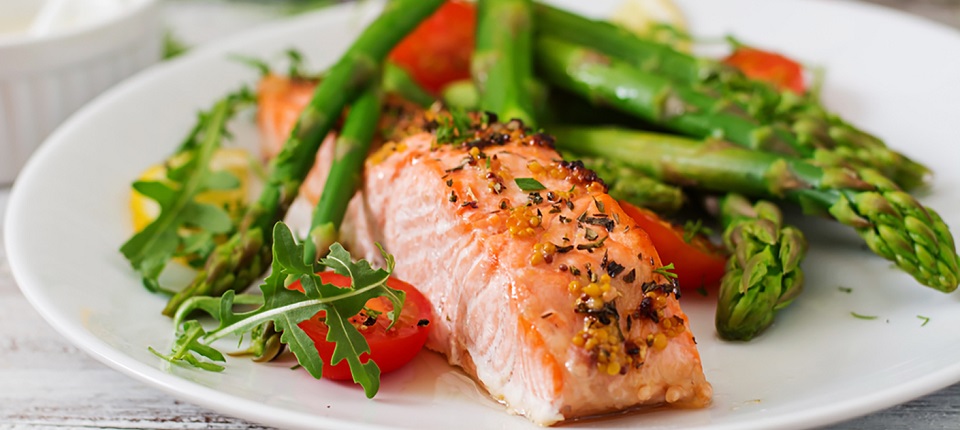 Baked salmon garnished with asparagus and tomatoes with herbs; Shutterstock ID 417233545; Other: ; Purchase Order: 123; Client/Licensee: ; Job: 
